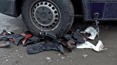 Boots Crushed Under Muddy Tires