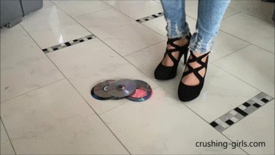 Jennifer Crushing Cd’s In High High-heeled shoes