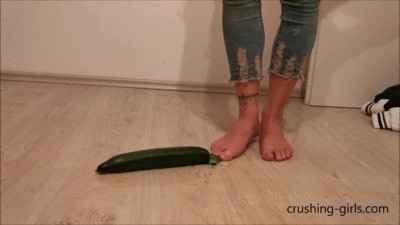 Jennifer Crushing A Cucumber