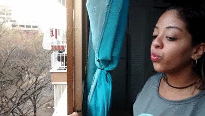 Spanish Woman Starts To Spit From Her Window