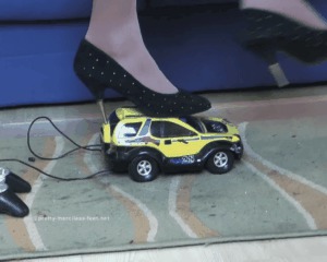 Car Crushed Under Spiked High-heeled shoes